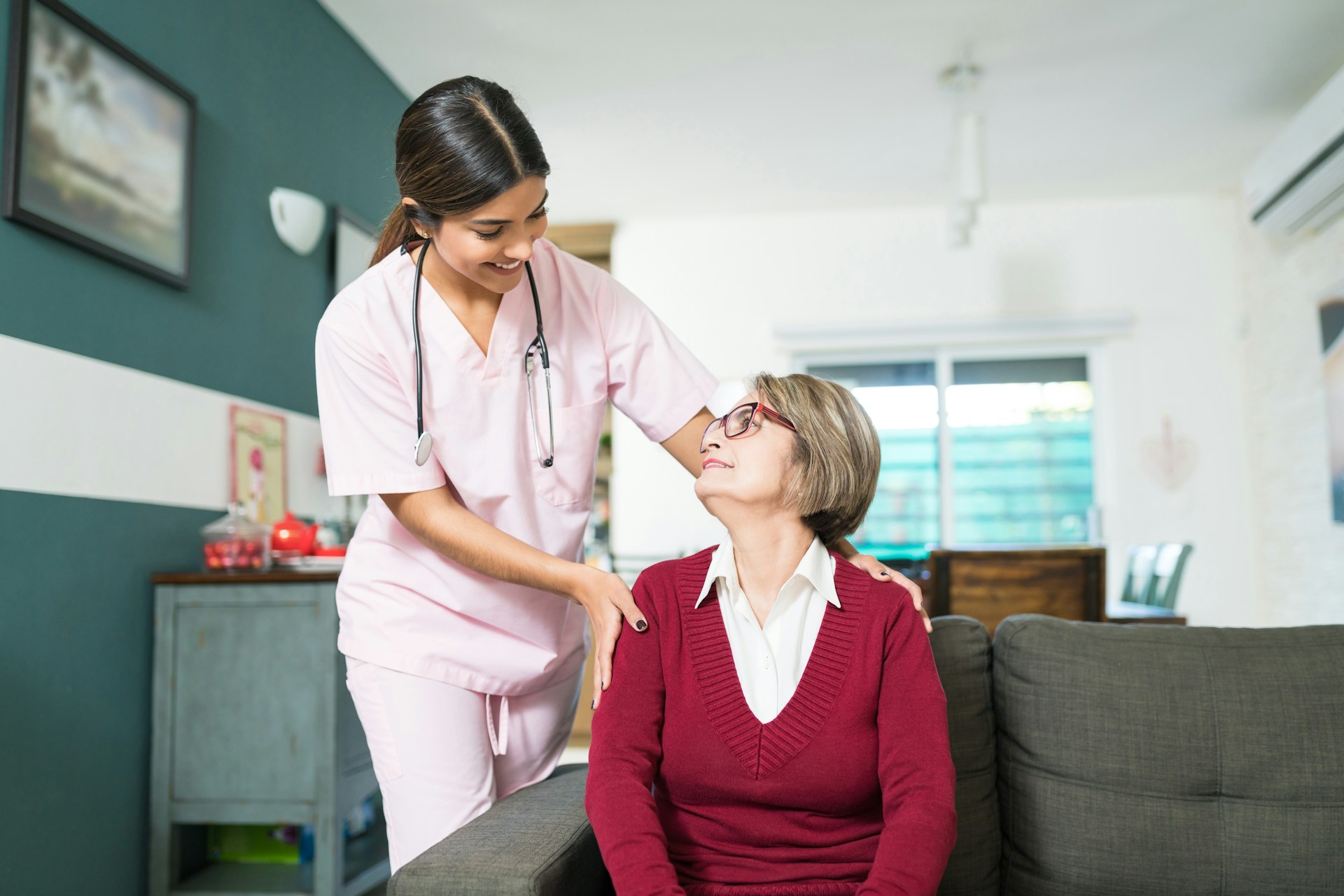 Compassionate caregiver with elderly patient